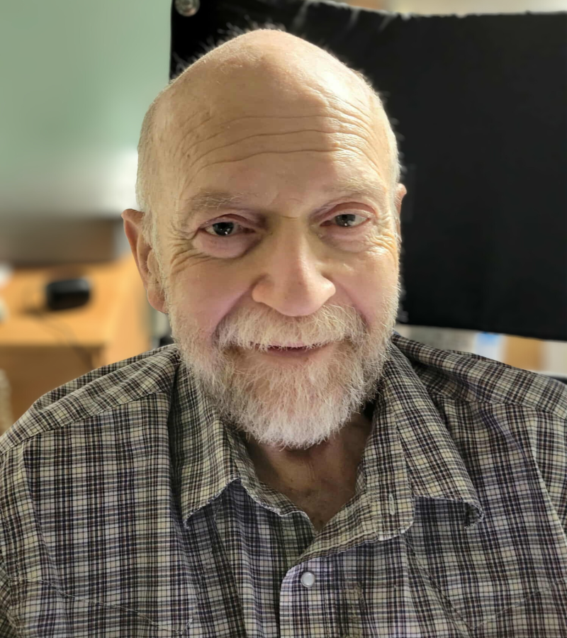 Richard Willowby man smiling with a graying beard and a black & white plaid shirt.